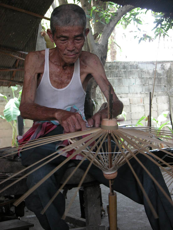 A very experienced umbrella maker, Chiang Mai.
