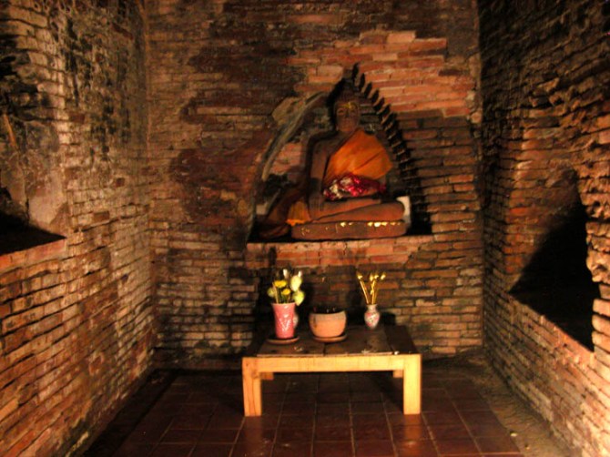 Buddha statue inside one of the tunnels (umongs) at Wat Umong, Chiang Mai
