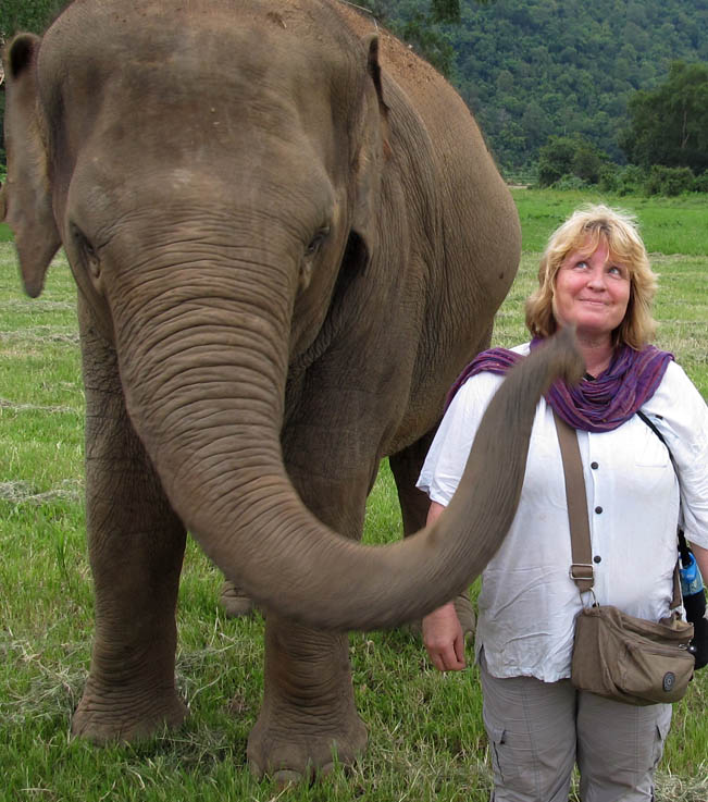 Playing with Faa Mai. Elephant Nature Park, Chiang Mai, Thailand.