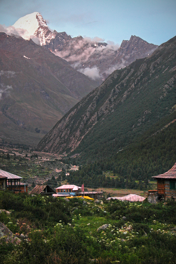 The village of Chitkul, below the Kinnaur Kailash mountain range, Himalayas. Over that snowy peak is Tibet.