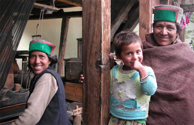 Local women with their 'topi's' (hats), denoting that they are 'Kinnauries' - from the Kinnaur districts of Himachel Pradesh, Himalayas. Chitkul.