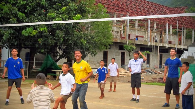 A very serious game of volleyball gets started at the school - kids versus ENP folks.